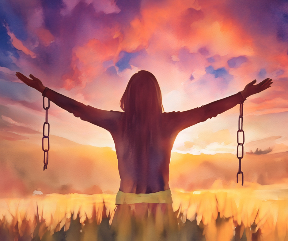 a woman with arms up in a field with chains